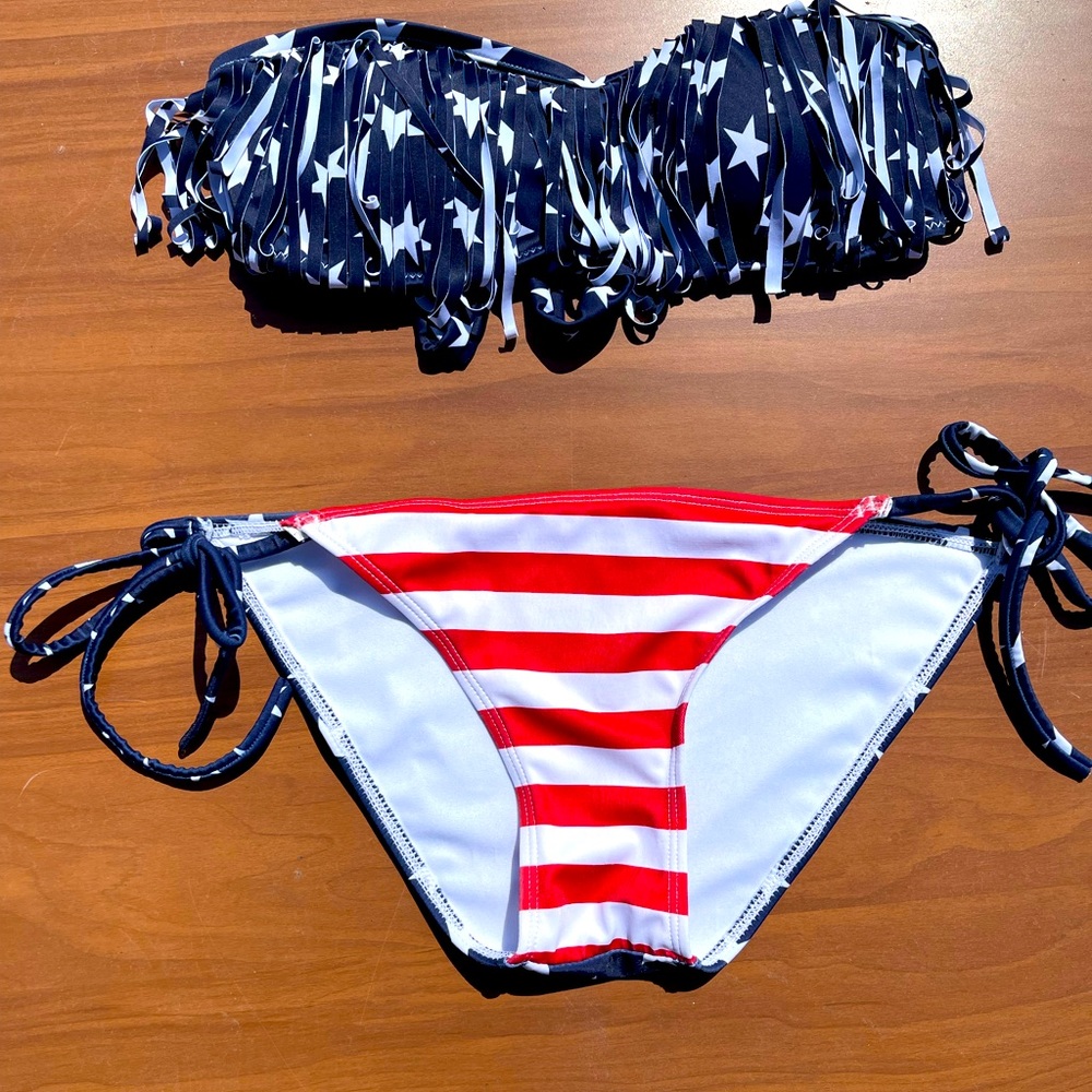 Small red white and blue fringe bikini, and has a strap option for halter.